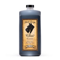 64oz Bottle of Black Scottie Chai with a label featuring a dog illustration on a white background