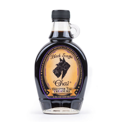 8oz Bottle of Black Scottie Chai syrup with a label on a white background