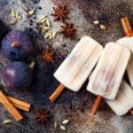 Masala chai popsicles with figs on cinnamon sticks. Spiced ice lollies for fall and winter season. Christmas holiday dessert